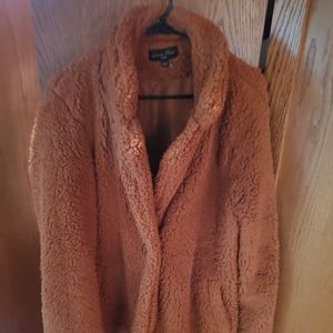 Furry brown coat. Car coat length